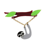 Laser cut acrylic brooch featuring a grey sloth hanging from a leafy branch