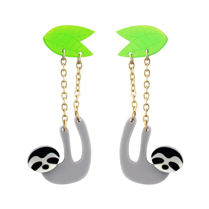 A pair of sloths hanging from green etched leaves
